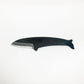 a carbon steel hand knife in the shape of a fin whale