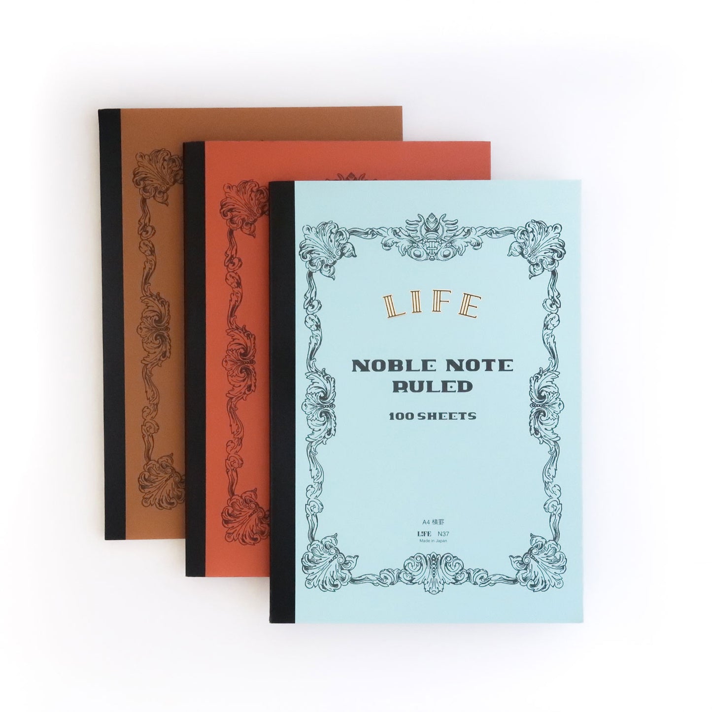 Notebooks with elaborate bordered cover with gold-foil printed LIFE logo, in light blue, orange, and brown